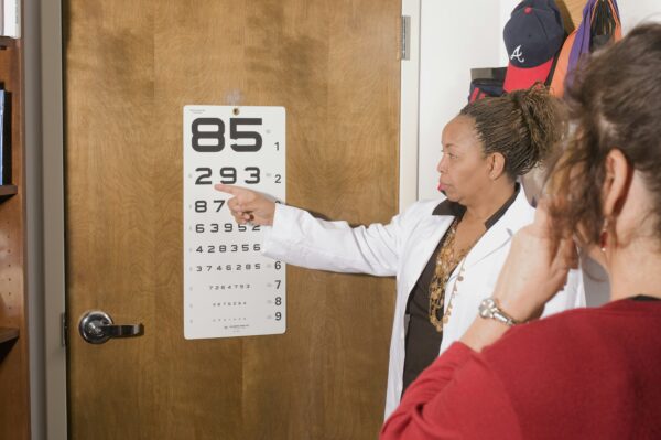Doctor pointing to eye chart